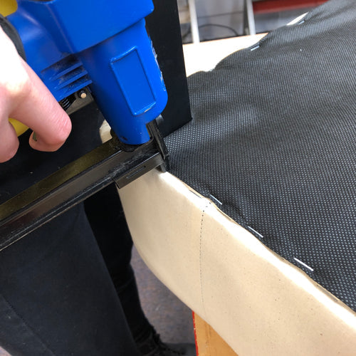 Stapling dustcover on chair bottom