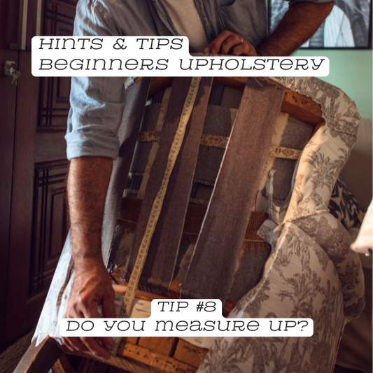 Measuring an armchair with tape measure