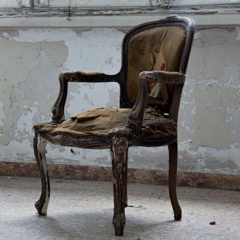 Old chair with brown springs on seat