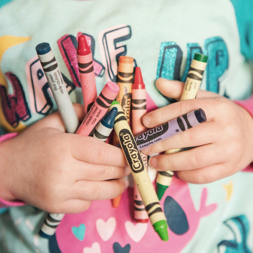Child holding crayons